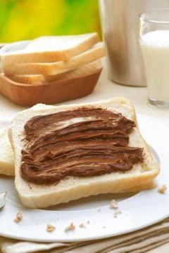 Tasty breakfast made of bread with chocolate cream Stock Photos