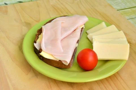 Tasty breakfast - slice of bread, ham and cheese Stock Photos