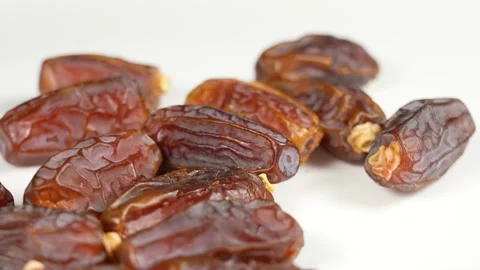 Tasty brown dried dates fruit isolated on white background Stock Footage 161326525
