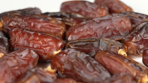 Tasty brown dried dates fruit isolated on brown background Stock Footage 161346402