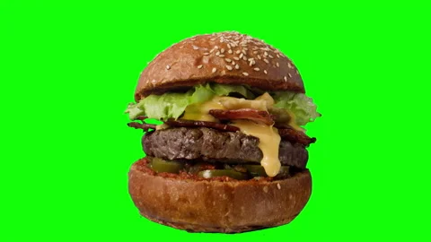 Tasty Burger On Green Background. Stock Footage 233164368