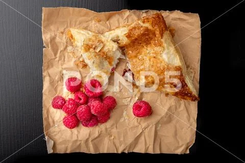 Tasty cake with shortcrust pastry with fruit. Fresh raspberries and cake on g Stock Photos