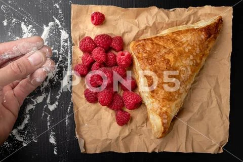 Tasty cake with shortcrust pastry with fruit. Fresh raspberries and cake on g Stock Photos