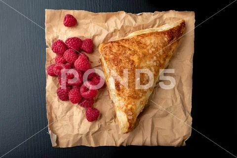Tasty cake with shortcrust pastry with fruit. Fresh raspberries and cake on g Stock Photos
