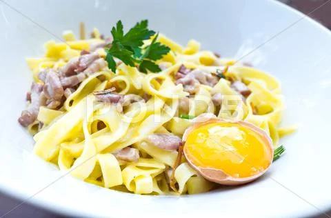 Tasty Carbonara pasta on the table Stock Photos