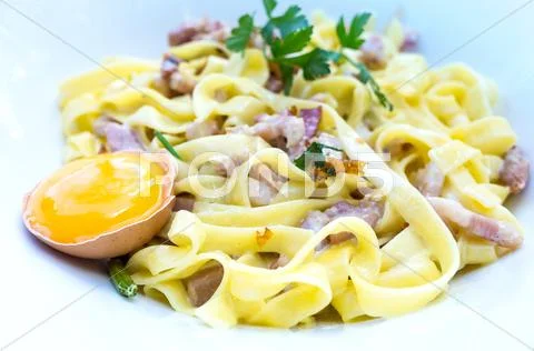 Tasty Carbonara pasta on the table Stock Photos