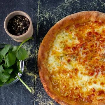 Tasty cheesy bread over a rustic background Stock Photos