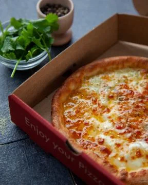 Tasty cheesy bread over a rustic background Stock Photos