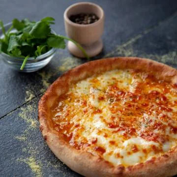 Tasty cheesy bread over a rustic background Stock Photos