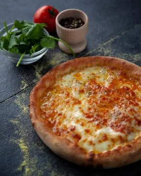 Tasty cheesy bread over a rustic background Stock Photos
