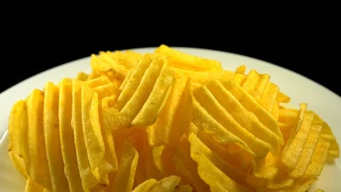 Tasty Chips rotate on a plate Stock Footage 88365548