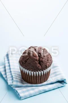 The tasty chocolate muffin. Stock Photos