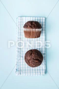 The tasty chocolate muffins. Stock Photos