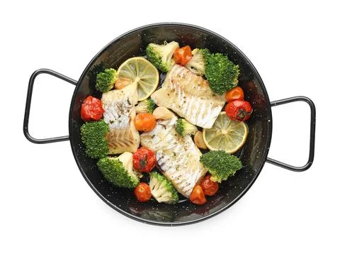 Tasty cod cooked with vegetables in frying pan isolated on white, top view Stock Photos