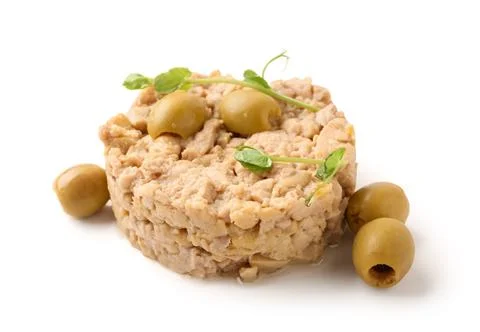 Tasty cod liver with micro green and olives on white background Stock Photos