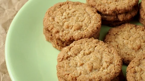 Tasty cookies biscuits. Stack of sugar cookies biscuits in green plate. Stock Footage 89934761