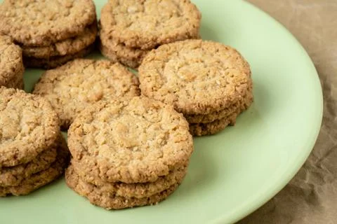 Tasty cookies biscuits. Stack of sugar cookies biscuits in green plate. Stock Photos
