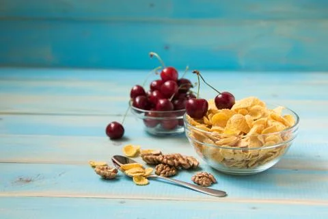 Tasty cornflakes with walnut and cherry Stock Photos