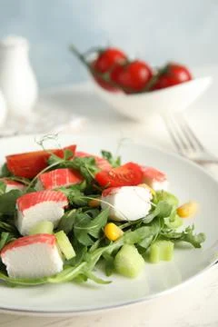 Tasty crab stick salad served on white table, closeup. Space for text Stock Photos