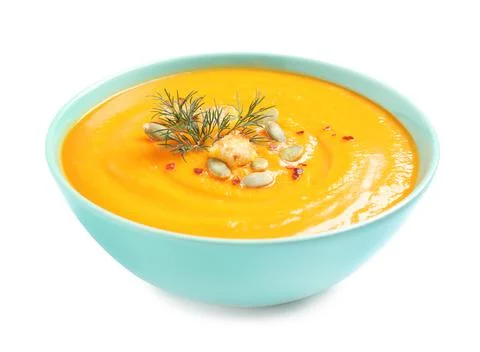 Tasty creamy pumpkin soup in bowl on white background Stock Photos