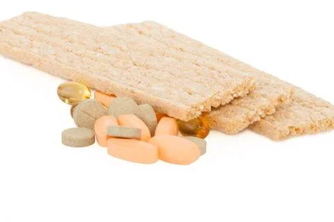 Tasty crispbread and tablets Stock Photos