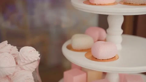 Tasty cute cakes on table Stock Footage 146242922