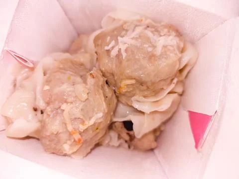 Tasty dim sum inside clean paper bag Stock Photos