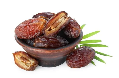 Tasty dried dates and leaf in bowl isolated on white 스톡 사진