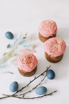 Tasty Easter cake, painted eggs, willow branches and toy bunny on table top view Stock Photos