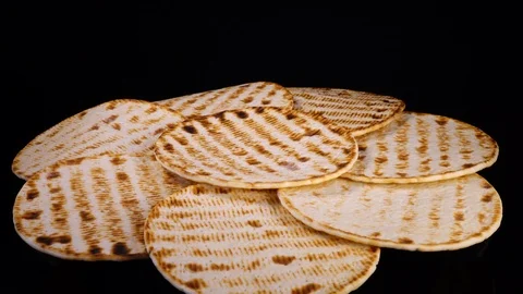 Tasty flat bread (lavash, pita, chapati, scone) rotating in 4K Stock Footage 90900153