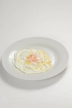 Tasty fried eggs Stock Photos