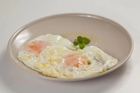 Tasty fried eggs Stock Photos