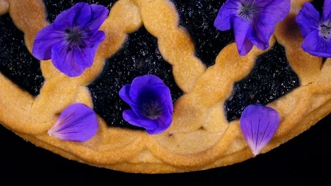Tasty garnishing cake with spotted crane's bill flowers (Geranium maculatum). 4K Stock Footage