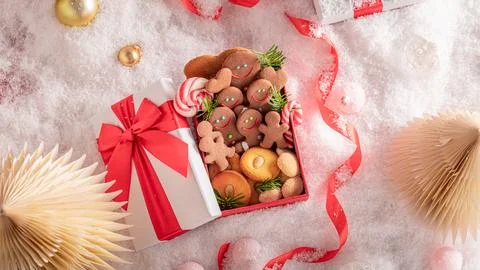 Tasty gingerbread figures packaged in gift box. Stock Photos