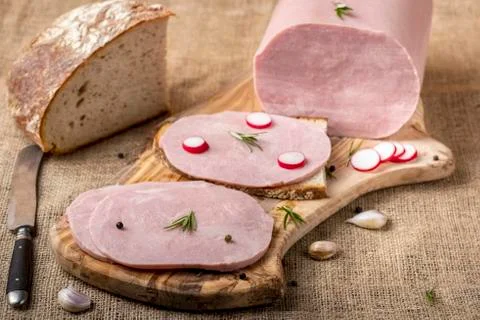 Tasty ham on a wooden board Stock Photos