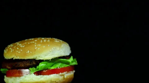 Tasty hamburger  rotate in  left corner Stock Footage 35995313