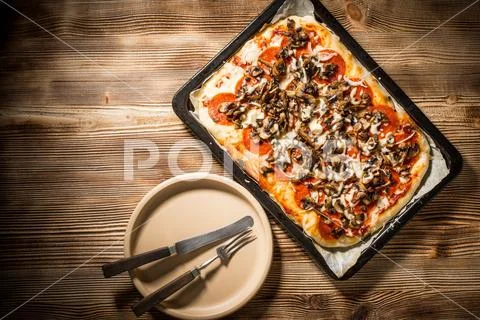 Tasty homemade pizza. Stock Photos