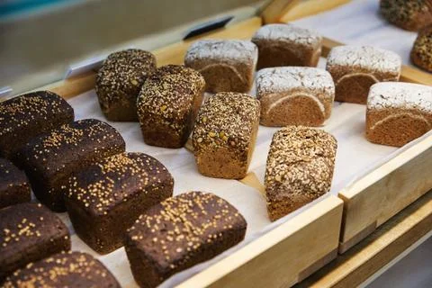 Tasty homemade rectangular black bread with seeds Stock Photos