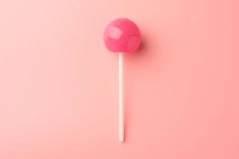 Tasty lollipop on pink background, top view Stock-Fotos