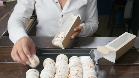 Tasty macarons Packed in a box in a candy store Stock Footage 95942524