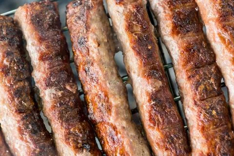 Tasty meat on a barbeque. Stock Photos