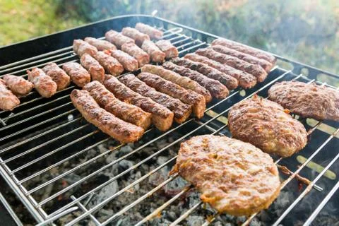 Tasty meat on a barbeque. Stock Photos