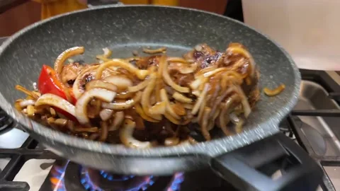 Tasty meat is fried in the pan in the kitchen Stock Footage 232042053