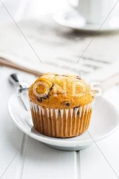 The tasty muffin with chocolate. Stock Photos