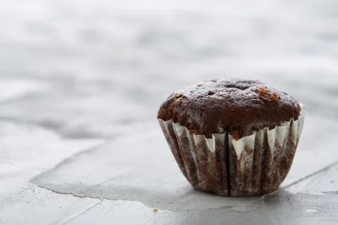 Tasty muffins arranged in pattern on light textured background, close-up Stock Photos