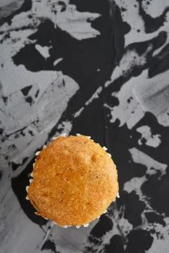 Tasty muffins arranged in pattern on light textured background, close-up Stock Photos