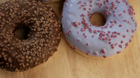 Tasty multicolored donuts rotating Stock Footage 108849181