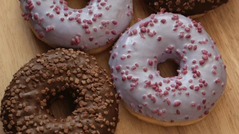 Tasty multicolored donuts rotating Stock Footage 108849267