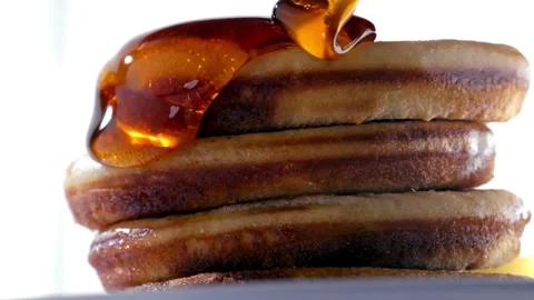 Tasty Pancakes served with Maple Syrup, close up. Stock-Footage 336589076