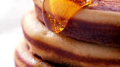 Tasty Pancakes served with Maple Syrup, close up. Видео 336589096
